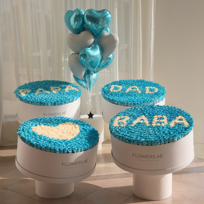 i also need alt text for this  5:27 PM Father's Day blue rose hatbox arrangements by Flowers.ae with PAPA, DAD, and BABA letter designs and heart balloons