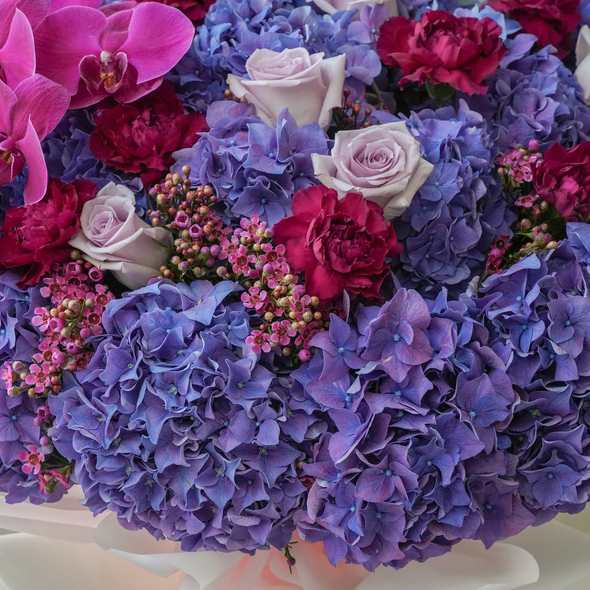 Blue Hydrangea with Purple Orchid